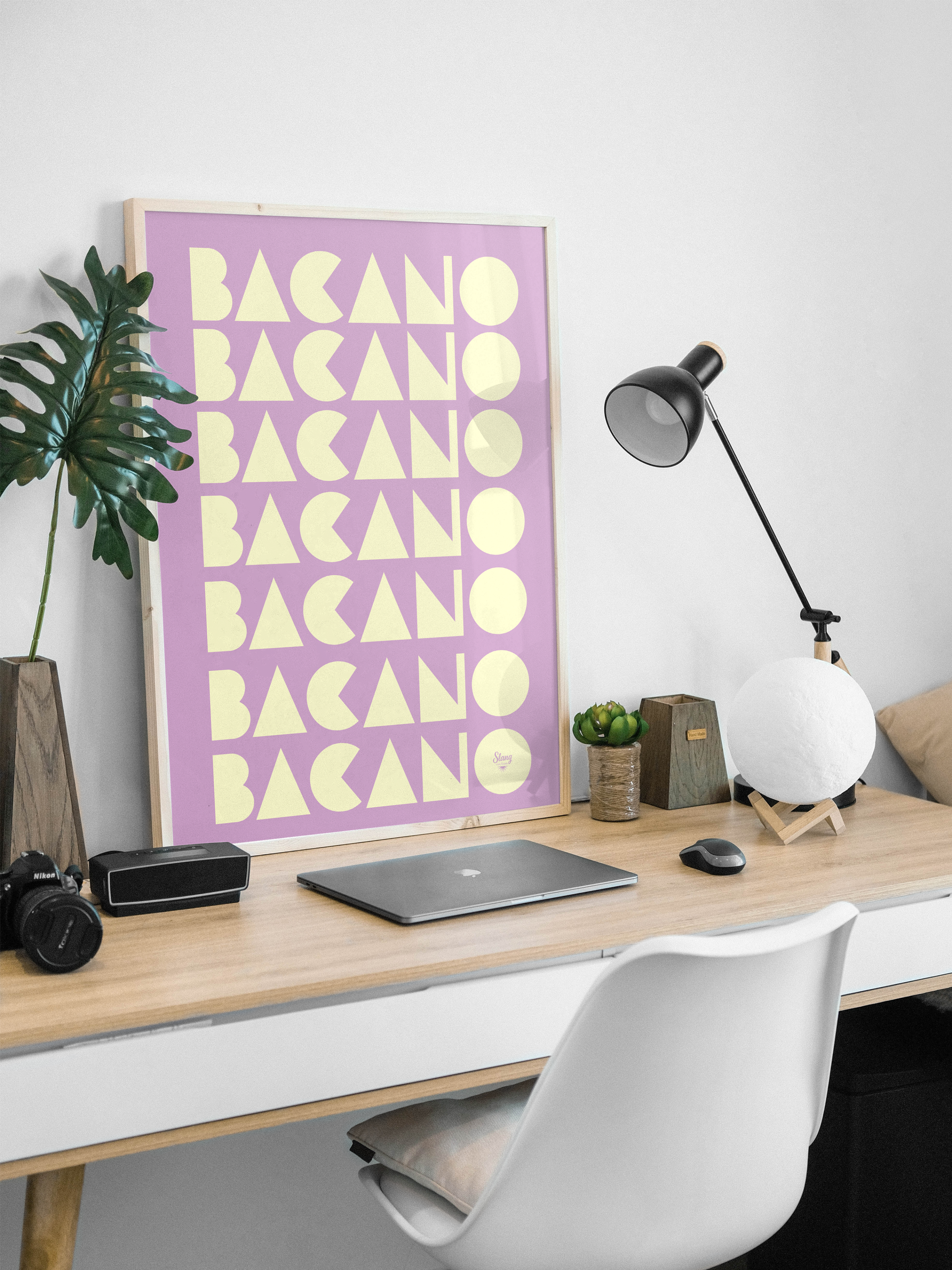 Educational Colombian slang poster displayed on a desk with notebooks and study materials.